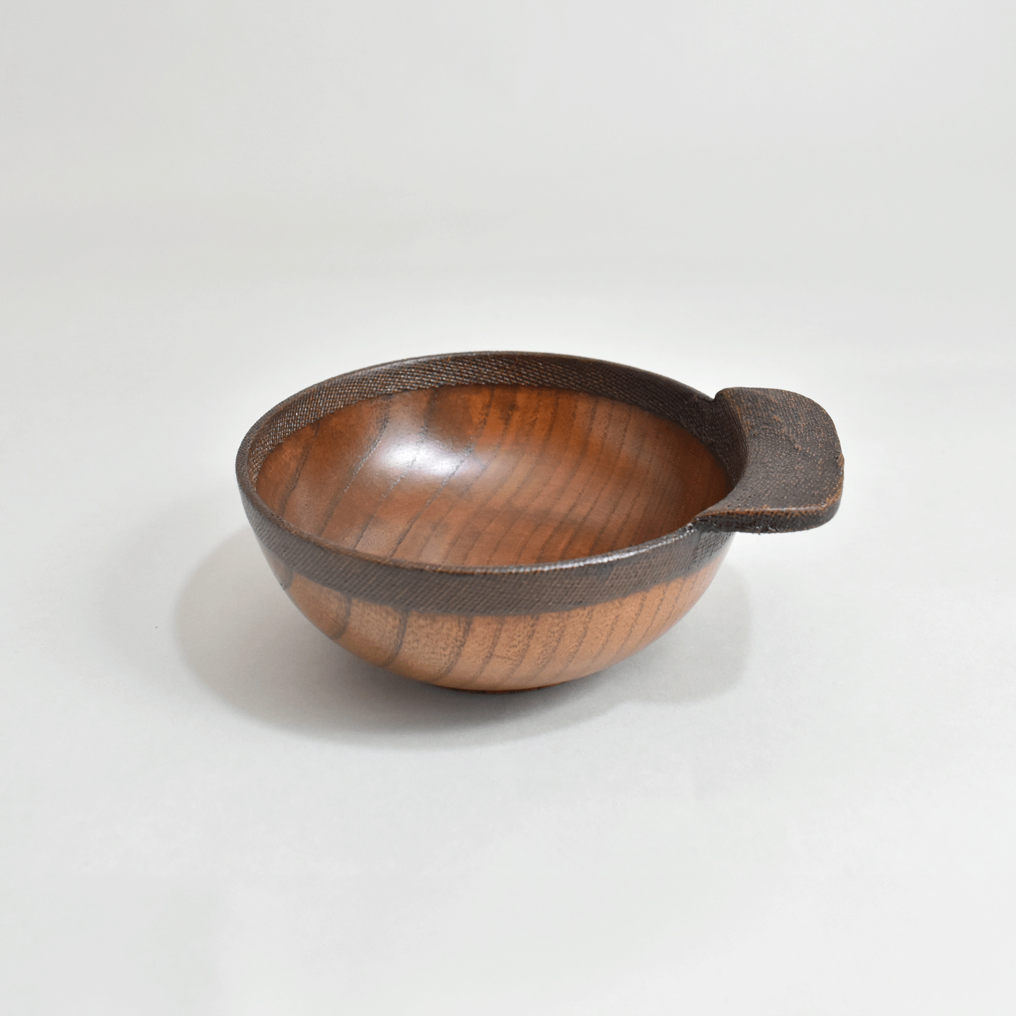 Wooden rice bowl with cloth and lacquer