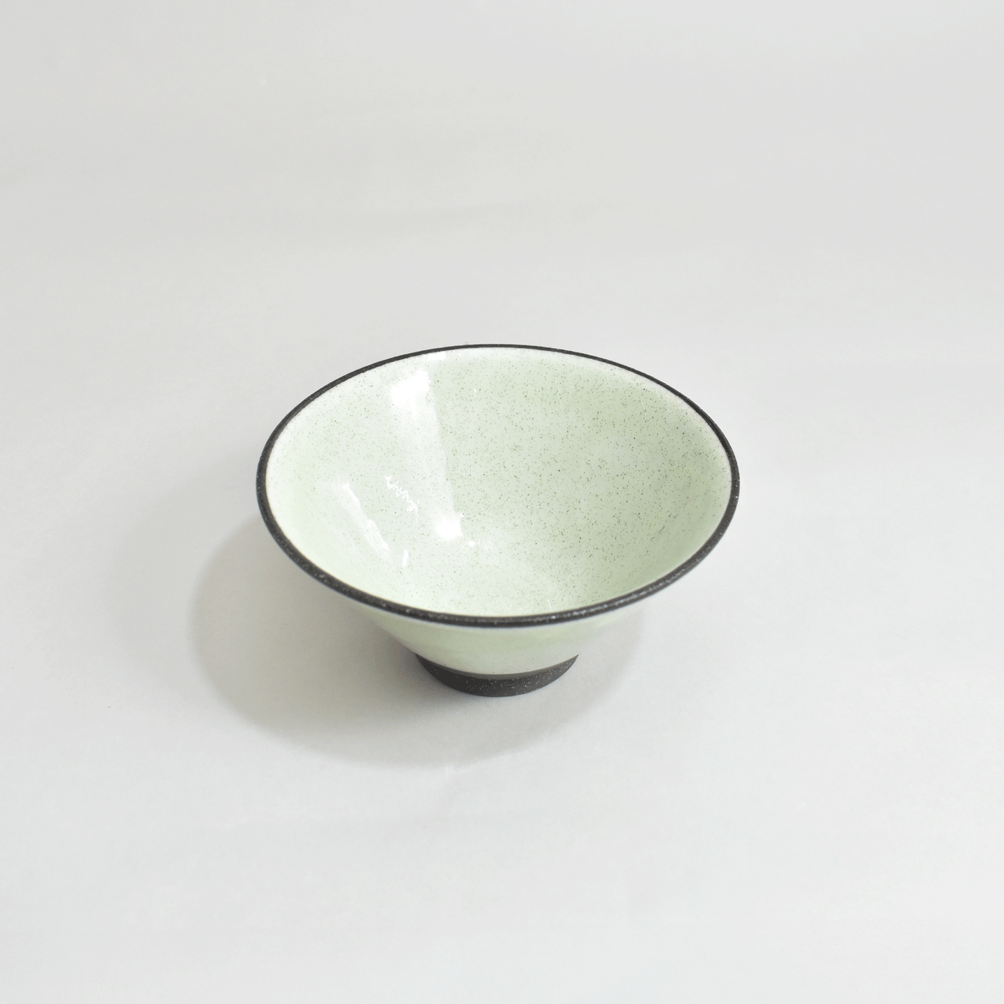 Black clay rice bowl with blue topaz