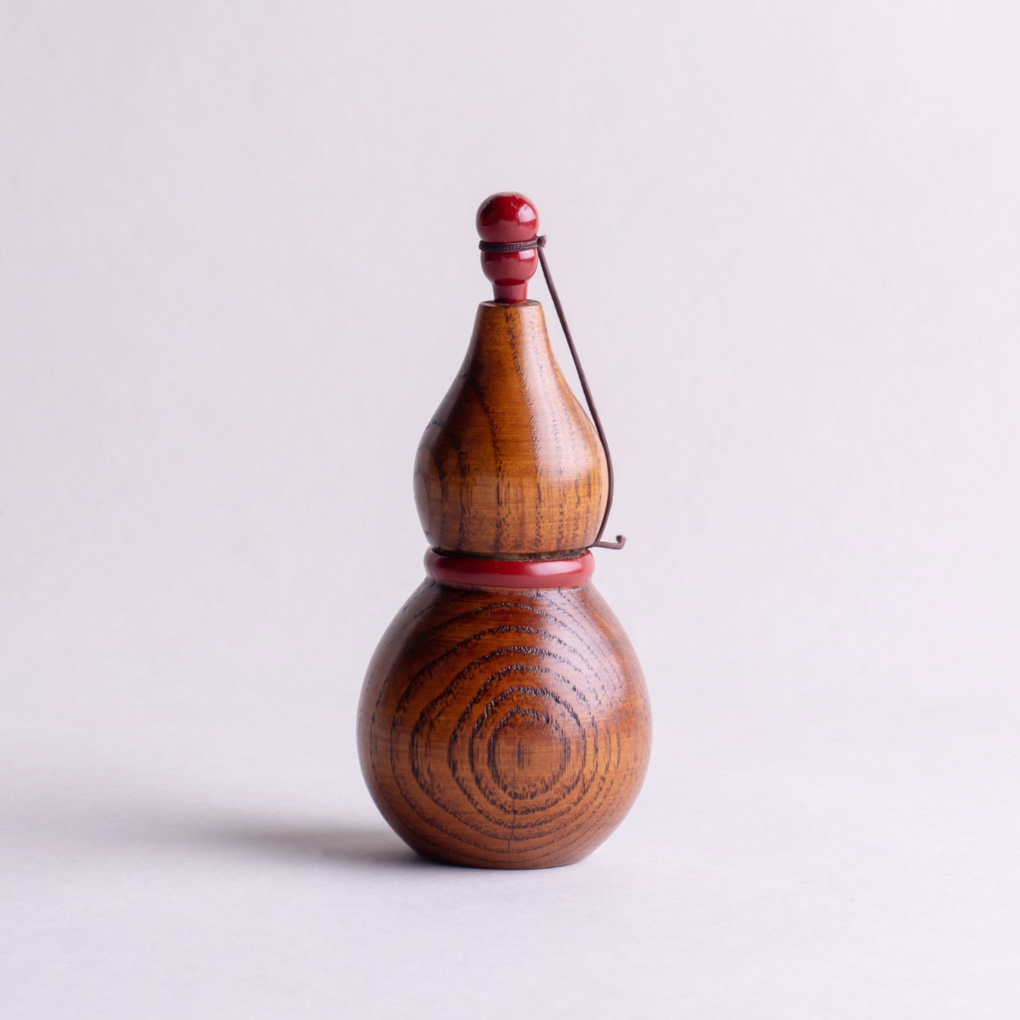 Wooden gourd shichimi container with red handle and string