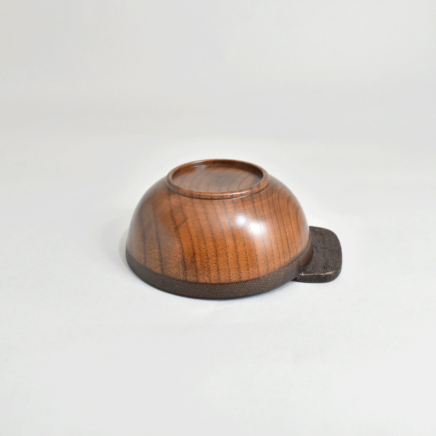 Wooden rice bowl with cloth and lacquer