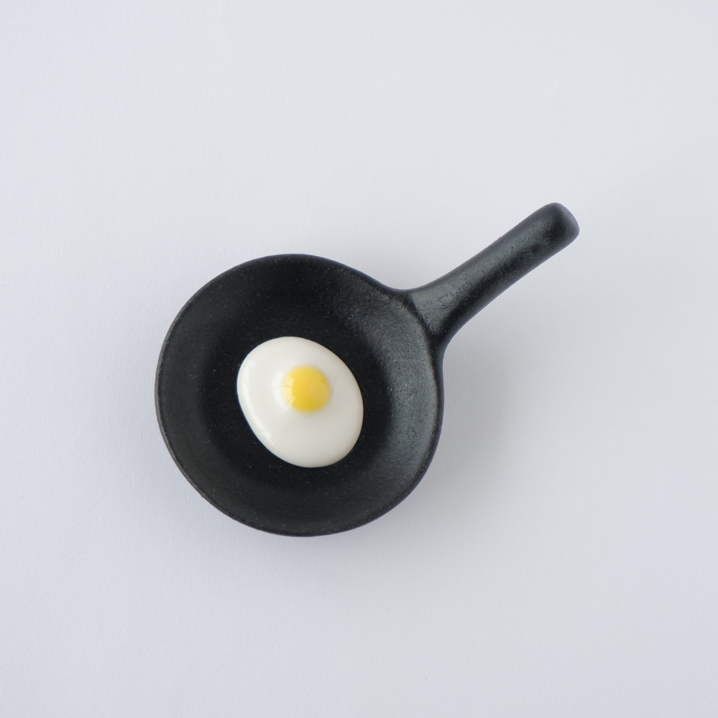 Chopstick rest Frying pan with fried egg