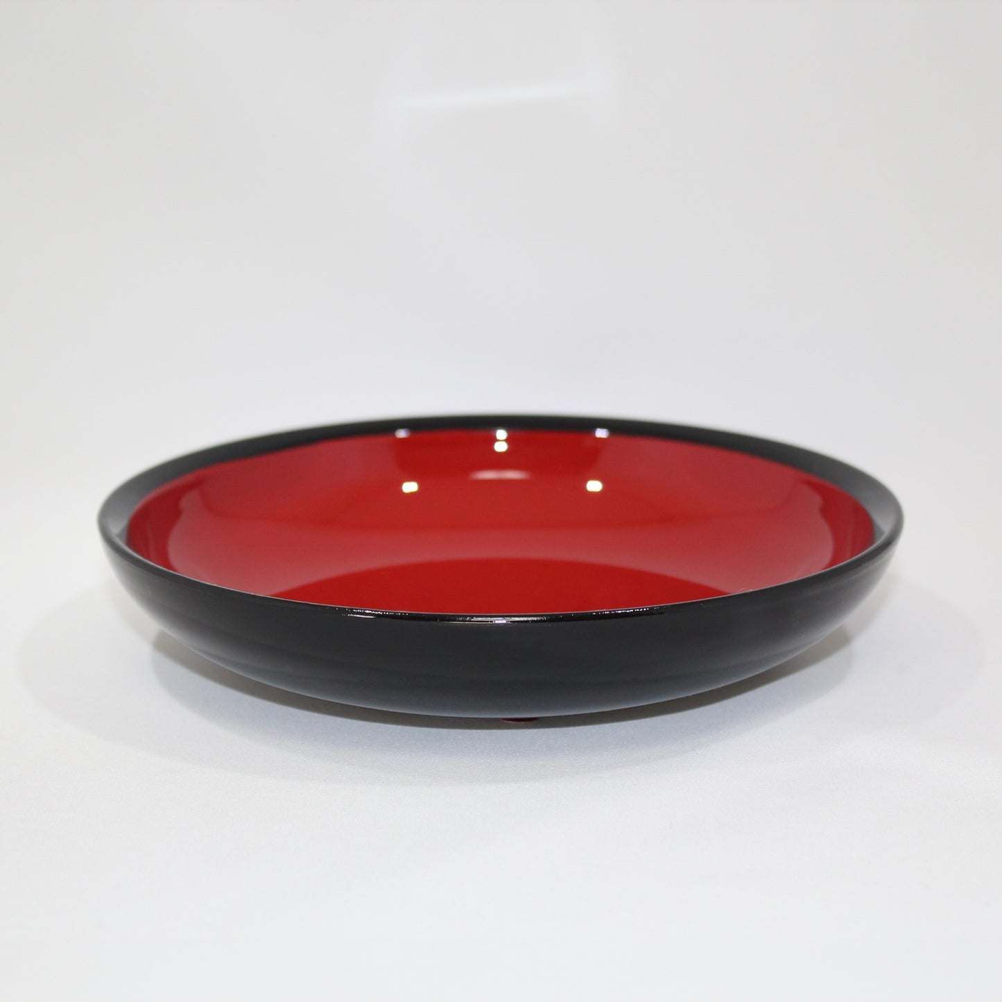 Black with red interior, fruit plate