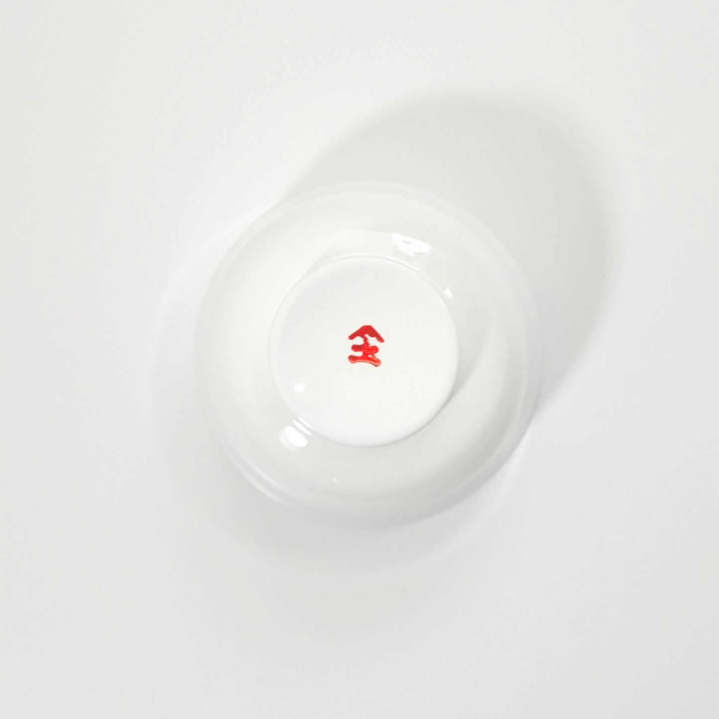 Soup bowl with white interior and red pattern