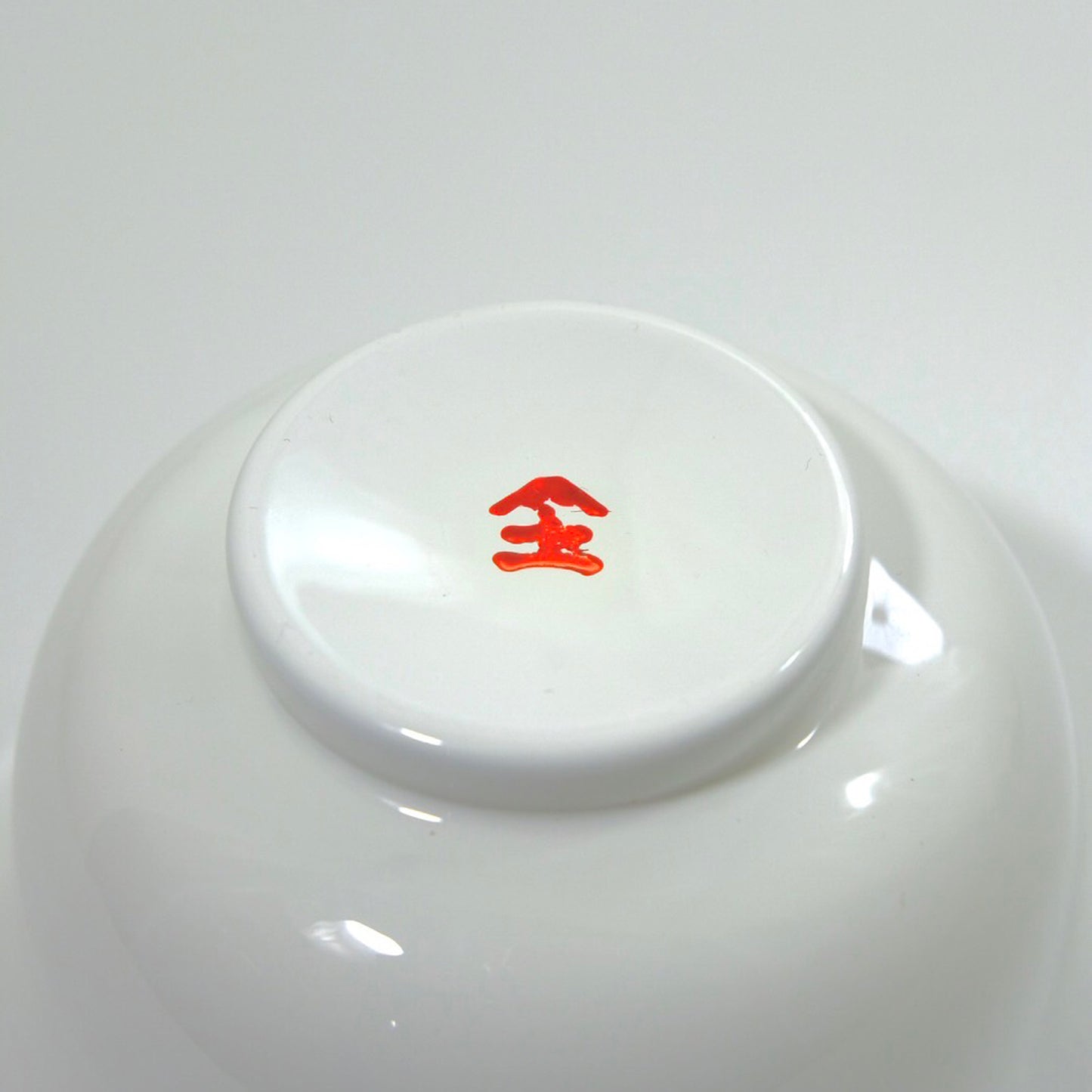 Soup bowl with white interior and red pattern