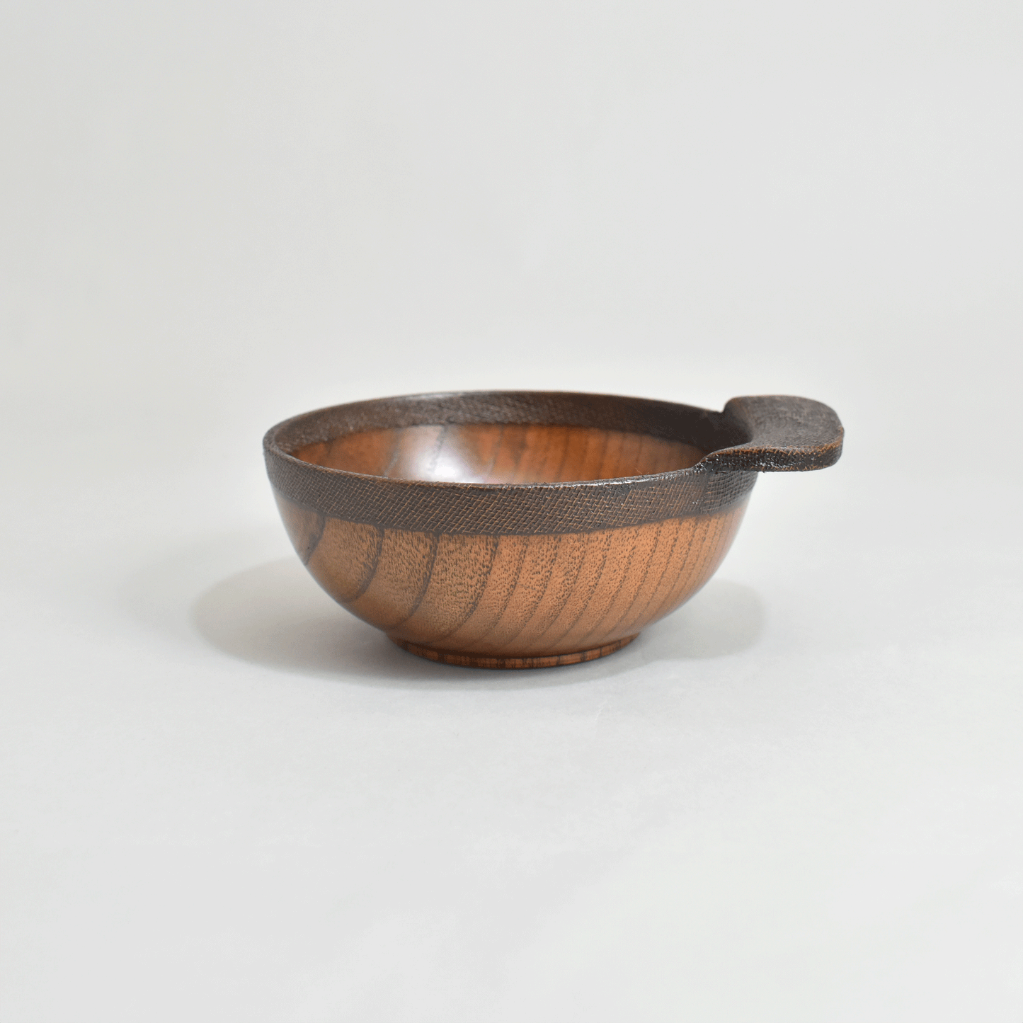 Wooden rice bowl with cloth and lacquer