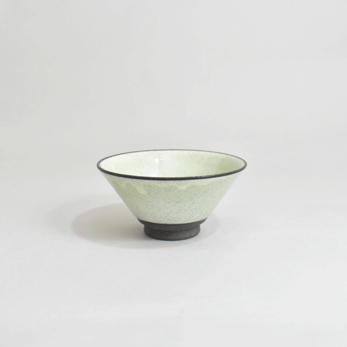Black clay rice bowl with blue topaz