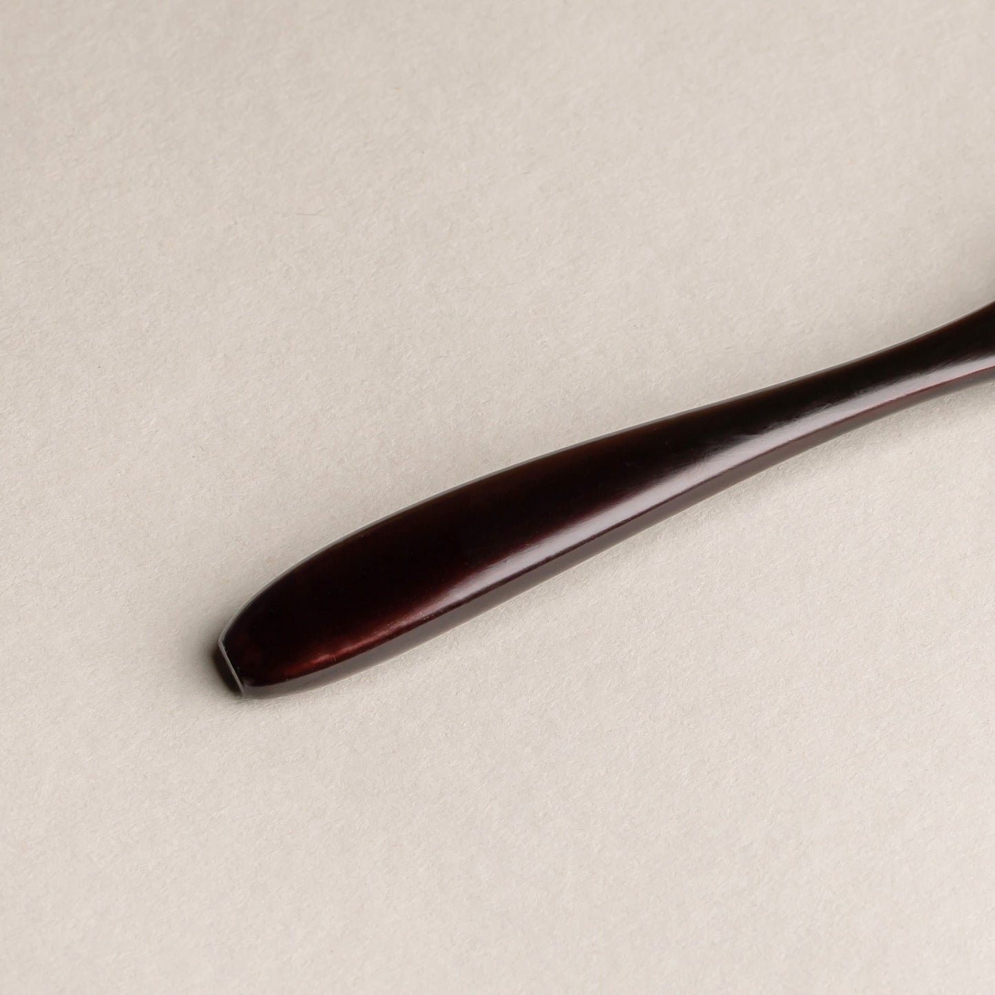 Wooden spoon with lacquer finish