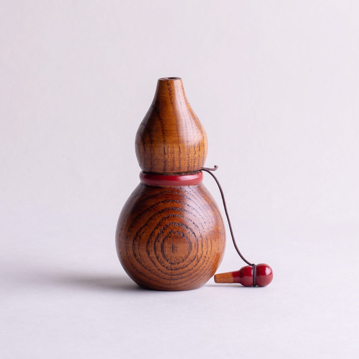 Wooden gourd shichimi container with red handle and string