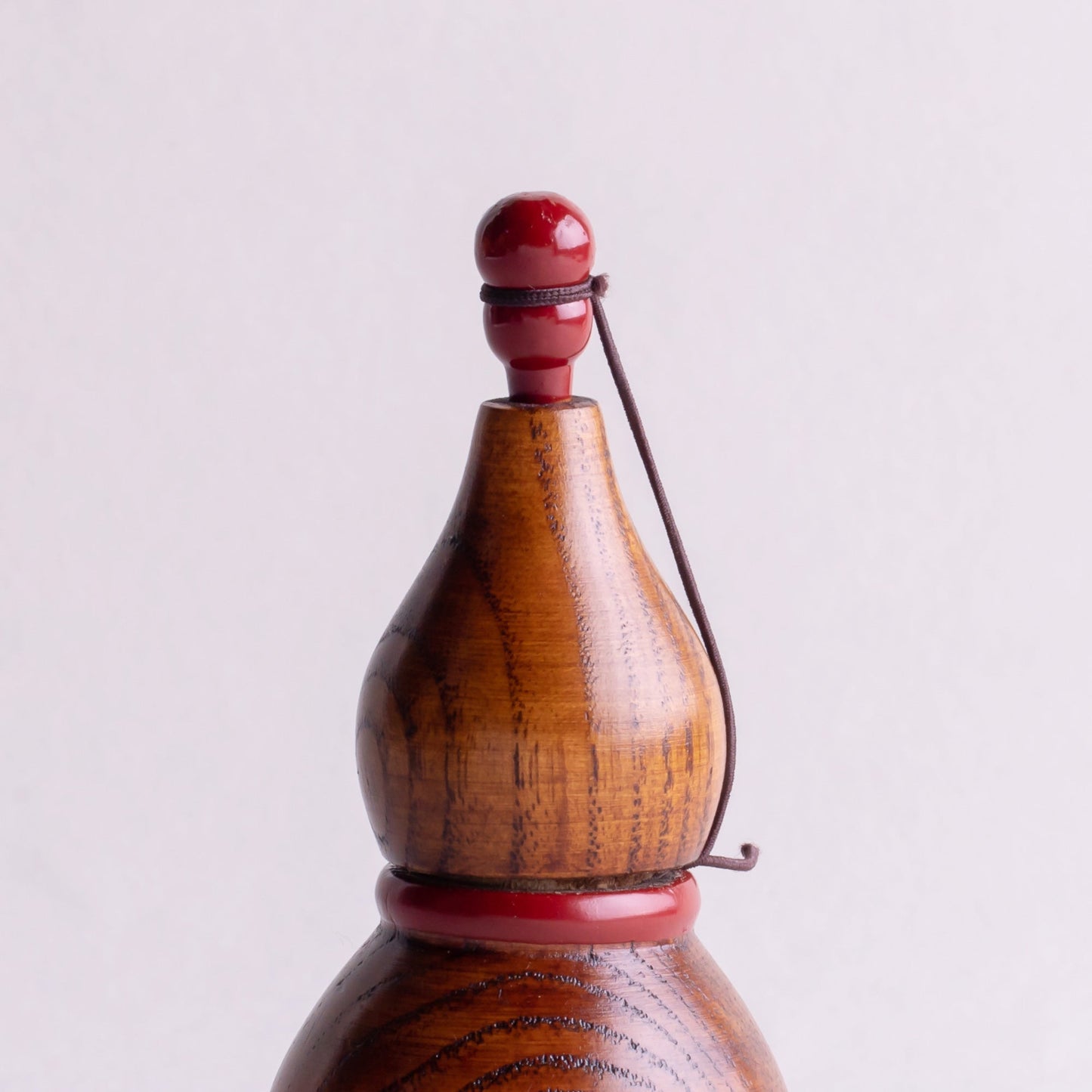 Wooden gourd shichimi container with red handle and string