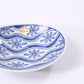Small oval plate with flowing water and floral design