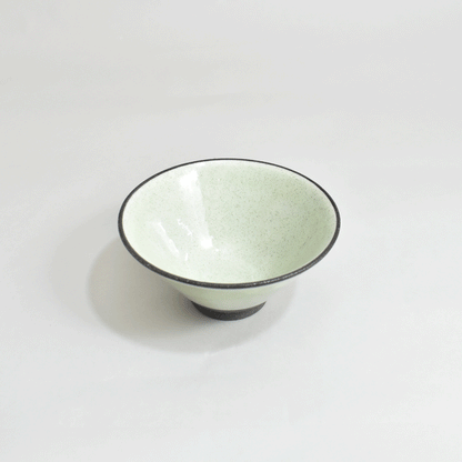 Black clay rice bowl with blue topaz