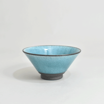Black clay rice bowl with blue topaz