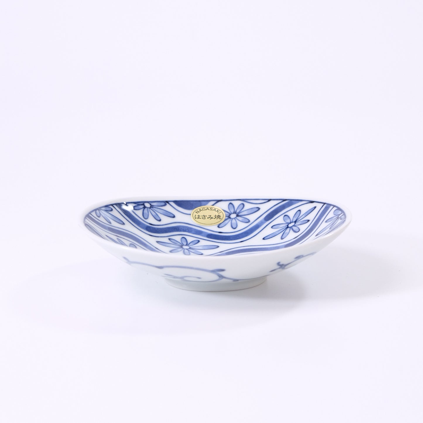 Small oval plate with flowing water and floral design