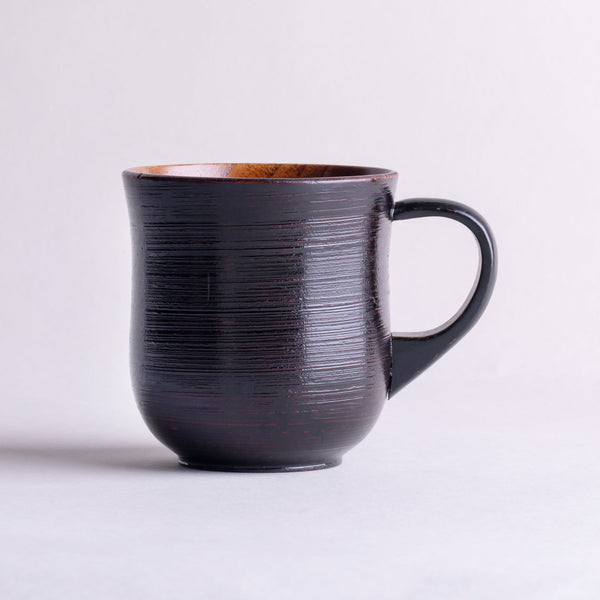 Wooden hollowed-out mug with brush marks